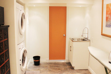 Inspiration for a contemporary laundry room remodel in Calgary