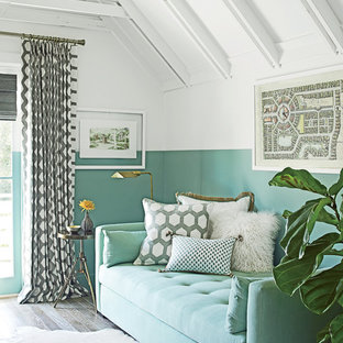 Small beach style home office in Miami with multi-coloured walls, medium hardwood floors, a built-in desk and no fireplace.