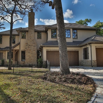 Combining Stucco and Stone bring charm to this Country French
