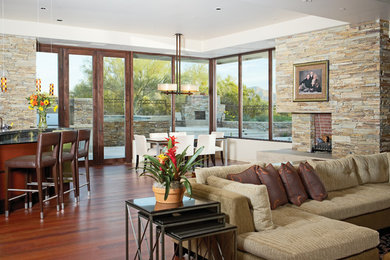 Great room - mid-sized transitional dark wood floor and brown floor great room idea in Other with white walls, a standard fireplace and a stone fireplace