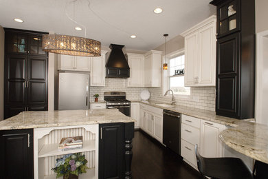 Enclosed kitchen - mid-sized traditional u-shaped dark wood floor and black floor enclosed kitchen idea in Minneapolis with an undermount sink, granite countertops, white backsplash, subway tile backsplash, stainless steel appliances, an island and white countertops