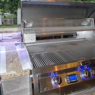 L Shaped Outdoor Kitchen With Unique Lighting