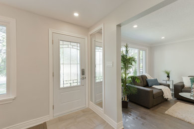 Example of a transitional home design design in Toronto