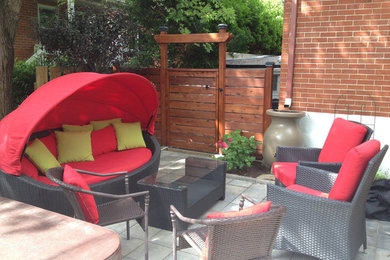 Inspiration for a backyard concrete paver patio remodel in Montreal