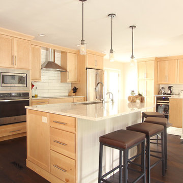 Natural Maple Cabinets in Open Kitchen with Quartz Countertops