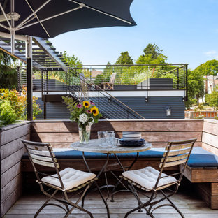 Example of a mid-sized transitional backyard outdoor kitchen deck design in Seattle