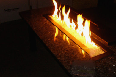 Example of a backyard patio design in Phoenix with a fire pit