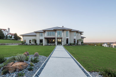 Large transitional beige two-story mixed siding house exterior idea in Dallas with a hip roof and a metal roof