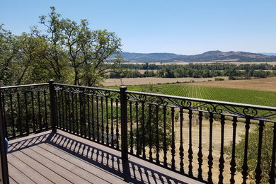Mid-sized transitional backyard deck photo in Other with no cover