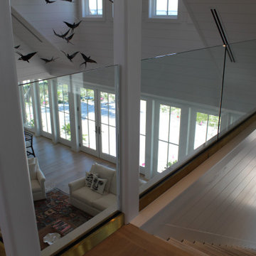 Glass Balustrade with Aluminum Base Rail Finished with Satin Brass Cladding