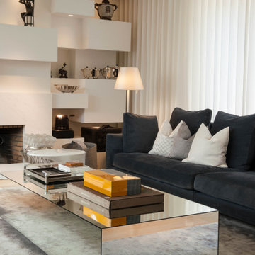 Parede living room with shelving, black sofa and cushions