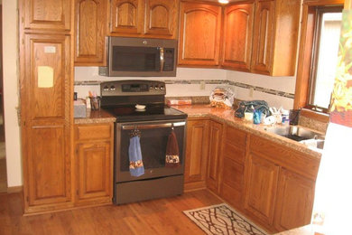 Inspiration for a kitchen remodel in Other with medium tone wood cabinets and quartz countertops