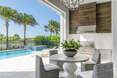 Example of a transitional patio design in Miami