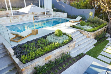 Photo of a large contemporary backyard formal garden for summer in Sydney.