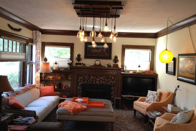 Inspiration for a mid-sized mid-century modern open concept dark wood floor living room library remodel in Portland with beige walls, a standard fireplace and a media wall