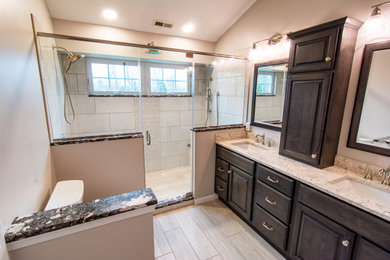 Large transitional master beige tile and porcelain tile porcelain tile, beige floor and double-sink bathroom photo in Philadelphia with flat-panel cabinets, gray cabinets, a two-piece toilet, beige walls, an undermount sink, quartz countertops, a hinged shower door, beige countertops and a built-in vanity
