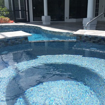 Glacier Travertine Deck and Glass tile on Pool
