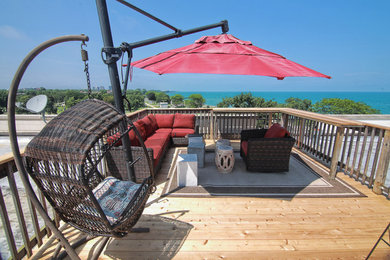 Inspiration for a large contemporary rooftop outdoor shower deck remodel in Chicago with an awning