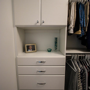 White Vanity with Freestanding Tub and Tiled Shower with Closet Storage