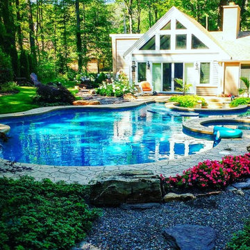 Pool and spa with a sunken fire pit.