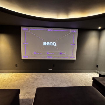 The Midnight Dome - Modern Black Home Theater with Coved Ceiling & Pit Sectional