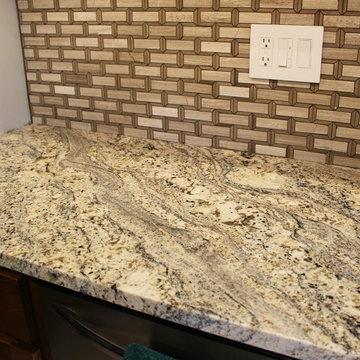 Kitchen With Unique Granite and Small Island in Moline, IL