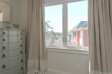 Inspiration for a mid-sized guest medium tone wood floor, beige floor and vaulted ceiling bedroom remodel in New York with beige walls and no fireplace