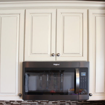 Cream Kitchen with Contrasting Dark Island with Quartz Countertop