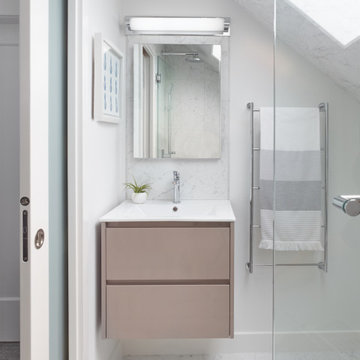 A light-coloured palette and wall-mounted fixtures keep this room feeling airy.