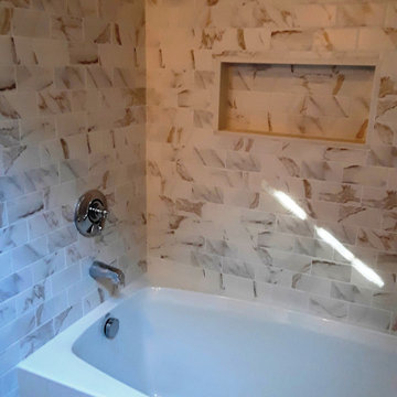 Moderately priced bath remodel with soaking tub and shower combination.