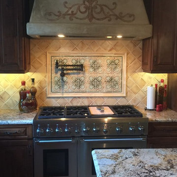 Old world plaster on Kitchen hood with hand painted art work