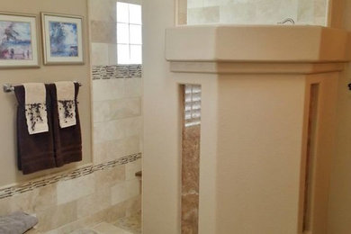 Huge southwest master beige tile and stone tile travertine floor bathroom photo in Phoenix with a drop-in sink, raised-panel cabinets, dark wood cabinets, granite countertops and beige walls