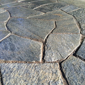 Chocolate Charcoal Quartzite Flagstone Patio with Basalt Column Fountain