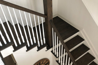 Inspiration for a small timeless wooden l-shaped wood railing staircase remodel in Tampa with wooden risers