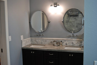 Example of a large transitional master gray tile and stone tile porcelain tile walk-in shower design in Orange County with an undermount sink, recessed-panel cabinets, dark wood cabinets, quartzite countertops, an undermount tub and a two-piece toilet