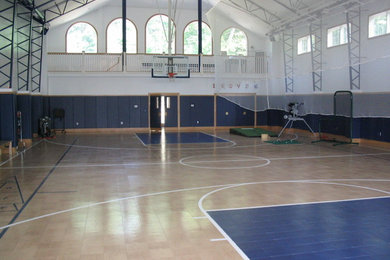 Inspiration for a mid-sized traditional indoor sport court in Boston with beige walls and light hardwood floors.