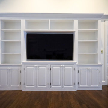 Statement-Making Living Room: Custom White Built-In Entertainment Center with Op
