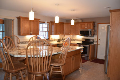 Photo of a mid-sized modern l-shaped eat-in kitchen in Other with a double-bowl sink, medium wood cabinets, stainless steel appliances and with island.