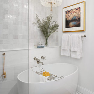Bathroom - mid-sized transitional master white tile and terra-cotta tile marble floor and white floor bathroom idea in Chicago with furniture-like cabinets, distressed cabinets, a one-piece toilet, white walls, a vessel sink, quartz countertops and white countertops
