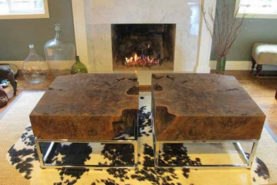 Example of a mid-sized trendy enclosed laminate floor and brown floor living room design in San Francisco with gray walls, a standard fireplace and a tile fireplace
