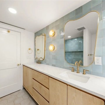 Custom tilework and modern fixtures elevate this bath retreat.