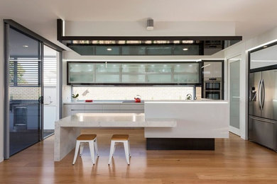 Large contemporary single-wall open plan kitchen in Melbourne with with island.