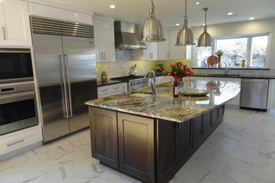 Mid-sized trendy u-shaped porcelain tile eat-in kitchen photo in Albuquerque with a double-bowl sink, raised-panel cabinets, white cabinets, solid surface countertops, white backsplash, mosaic tile backsplash, stainless steel appliances and an island