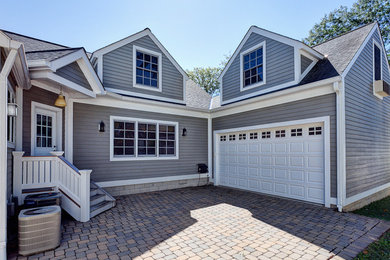 Inspiration for a mid-sized contemporary gray two-story exterior home remodel in Columbus