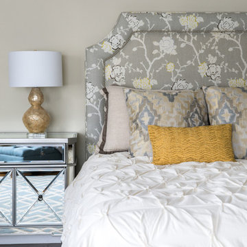 Traditional Bedroom with Patterned Grey Headboard and Mirrored Nightstand