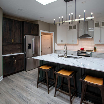 3 Finishes on Kitchen Cabinetry with Galley Workstation in Island and Wine Bar