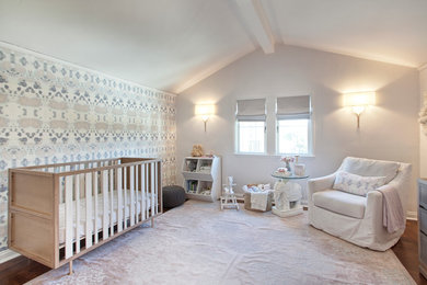 Design ideas for a contemporary nursery for girls in San Francisco with medium hardwood floors.
