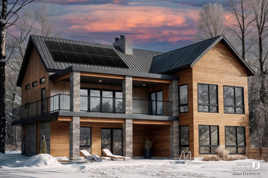 Inspiration for a mid-sized cottage brown two-story wood and clapboard exterior home remodel in Montreal with a metal roof and a black roof