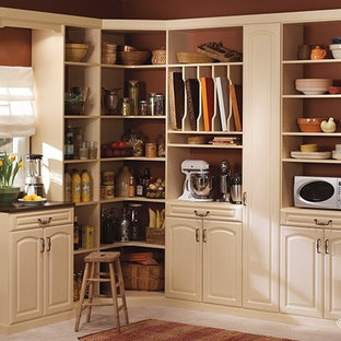 Mid-sized traditional kitchen pantry designs - Inspiration for a mid-sized timeless l-shaped ceramic floor kitchen pantry remodel in Newark with raised-panel cabinets, white cabinets and no island