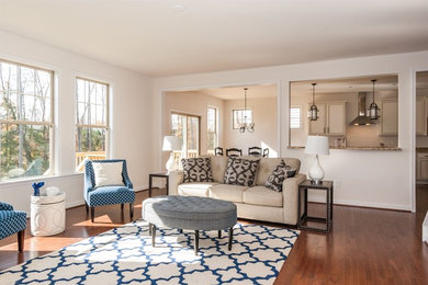 Inspiration for a mid-sized transitional open concept dark wood floor family room remodel in Richmond with beige walls, a standard fireplace, a stone fireplace and a tv stand